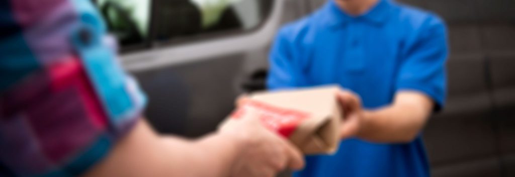 close up smiley delivery man scaled 1